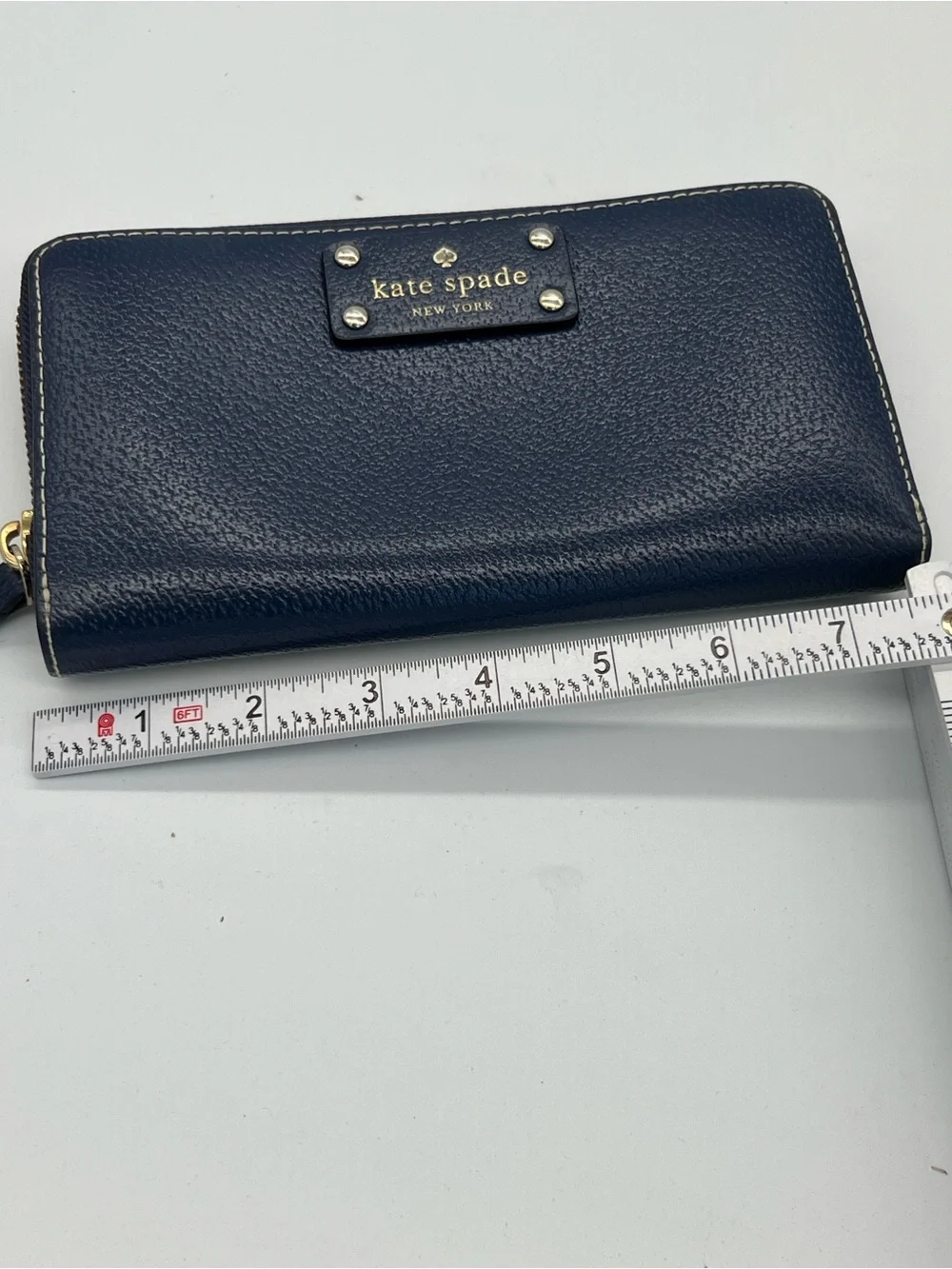 kate spade navy pebbled leather zip wallet with gold plaque